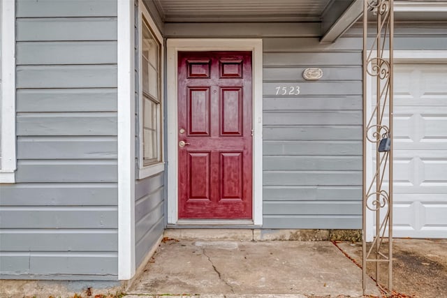 entrance to property featuring a garage