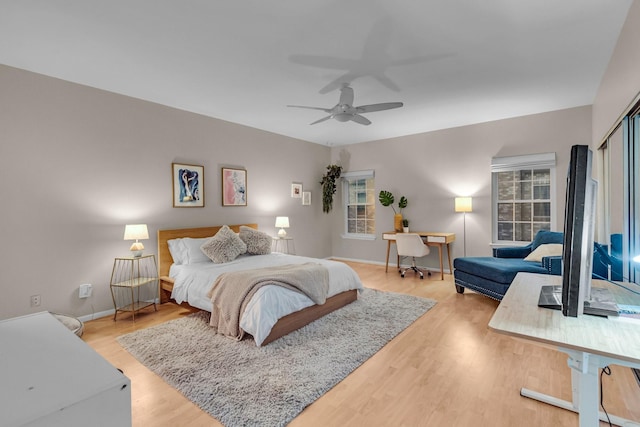 bedroom featuring hardwood / wood-style flooring and ceiling fan