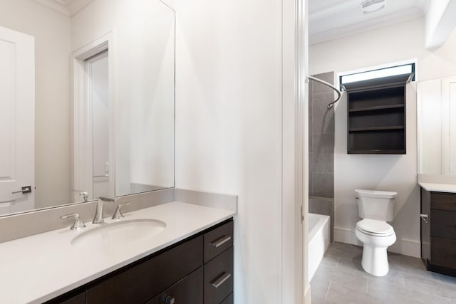 full bathroom with vanity, tiled shower / bath, crown molding, and toilet