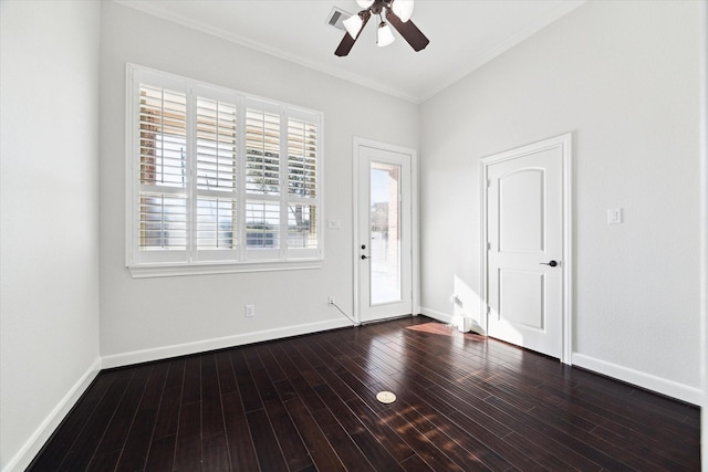 foyer entrance with crown molding, dark wood-type flooring, and ceiling fan