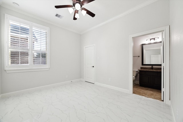 unfurnished bedroom featuring crown molding, ensuite bath, and ceiling fan