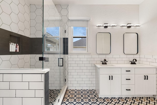 bathroom featuring vanity, tile walls, and an enclosed shower