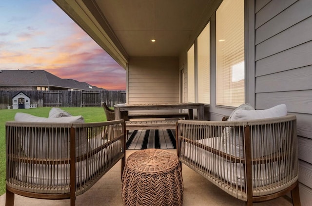 view of balcony at dusk