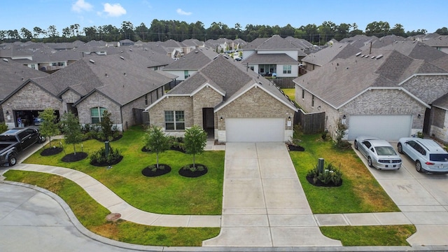 view of front facade featuring a garage and a front yard