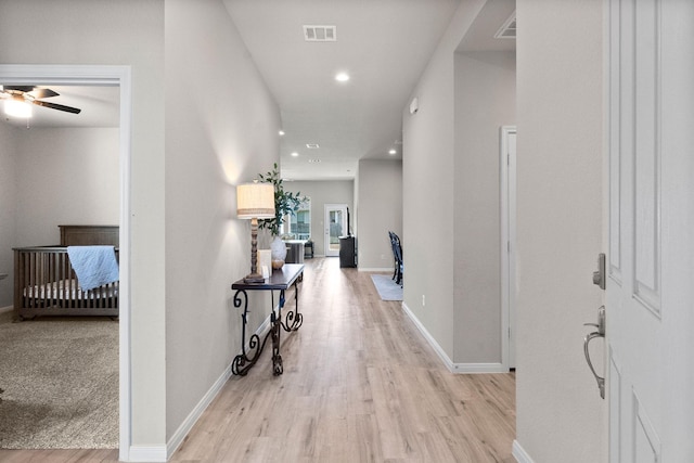 hallway featuring light hardwood / wood-style flooring