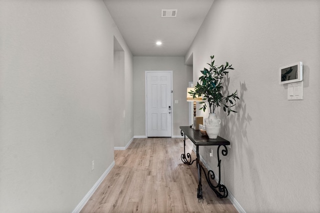 hall featuring light hardwood / wood-style flooring