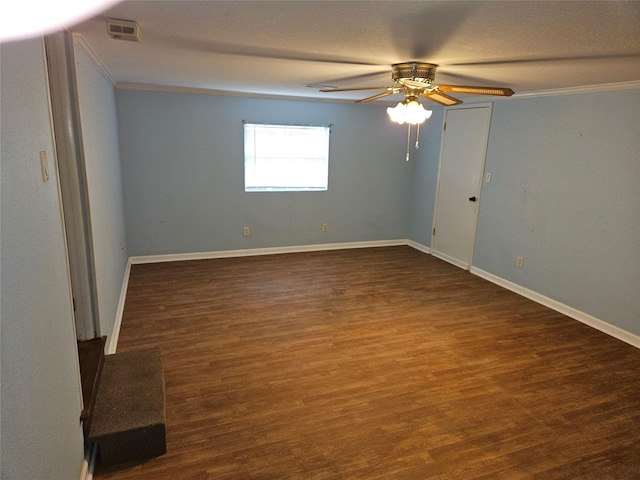 unfurnished room featuring dark hardwood / wood-style flooring, crown molding, and ceiling fan