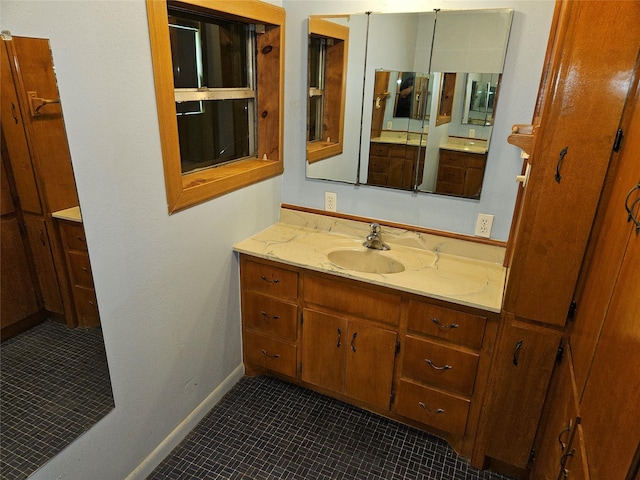 bathroom with vanity and tile patterned floors