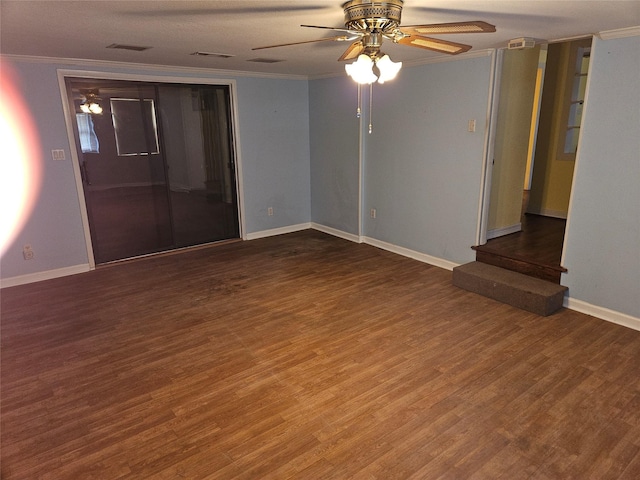 unfurnished room featuring ceiling fan, ornamental molding, and dark hardwood / wood-style floors