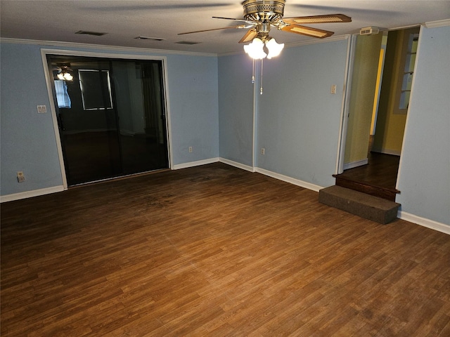 empty room featuring wood-type flooring, ornamental molding, and ceiling fan