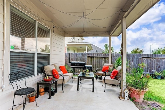 view of patio / terrace with grilling area and an outdoor hangout area