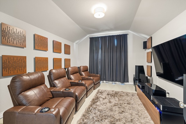 cinema room featuring vaulted ceiling