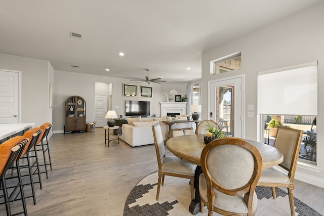 dining room featuring ceiling fan and light wood-type flooring