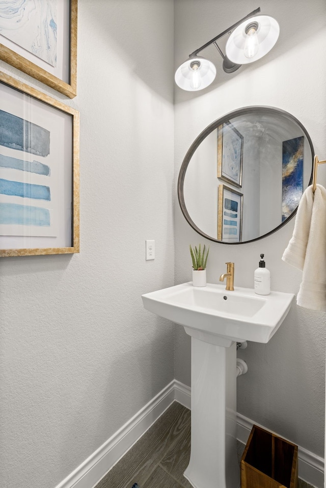 bathroom with sink and wood-type flooring