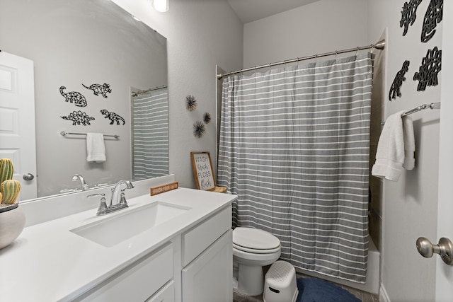 full bathroom with vanity, toilet, and shower / tub combo with curtain