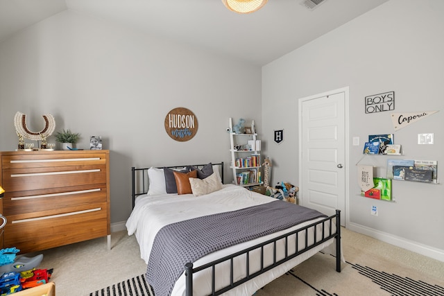 carpeted bedroom featuring vaulted ceiling