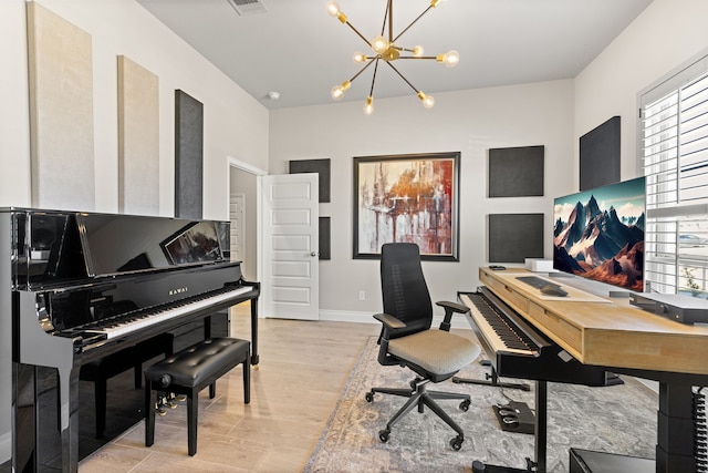 office featuring a notable chandelier and light hardwood / wood-style flooring