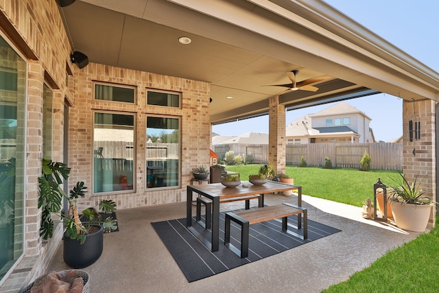 view of patio / terrace featuring ceiling fan