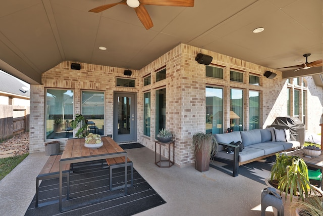 view of patio / terrace with an outdoor living space, ceiling fan, and a grill