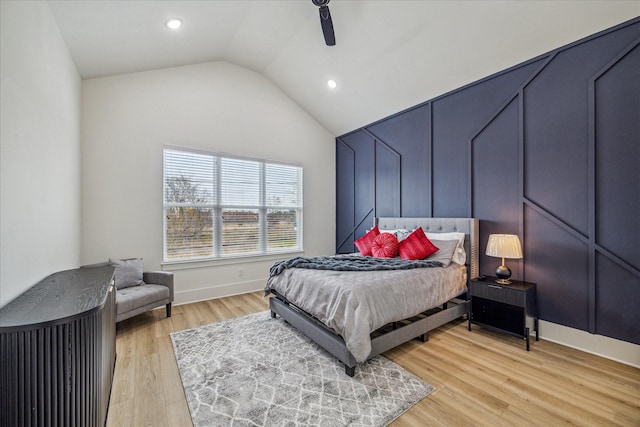 bedroom featuring vaulted ceiling, ceiling fan, and light hardwood / wood-style flooring