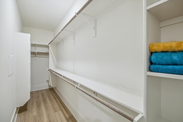 walk in closet featuring light wood-type flooring