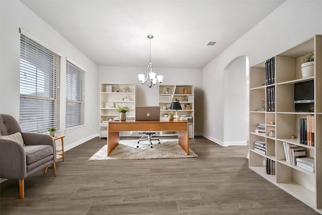 office area featuring dark hardwood / wood-style flooring and an inviting chandelier