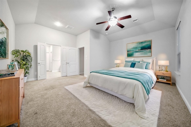 carpeted bedroom featuring vaulted ceiling and ceiling fan