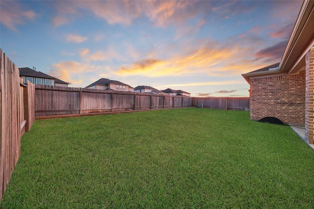 view of yard at dusk