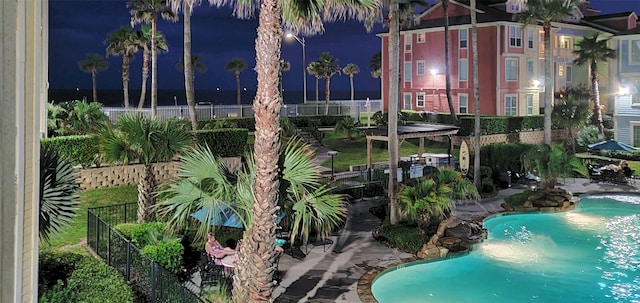 view of pool at night