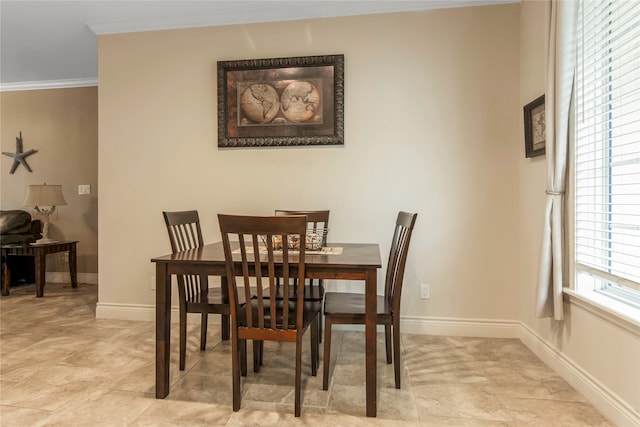 dining area featuring ornamental molding