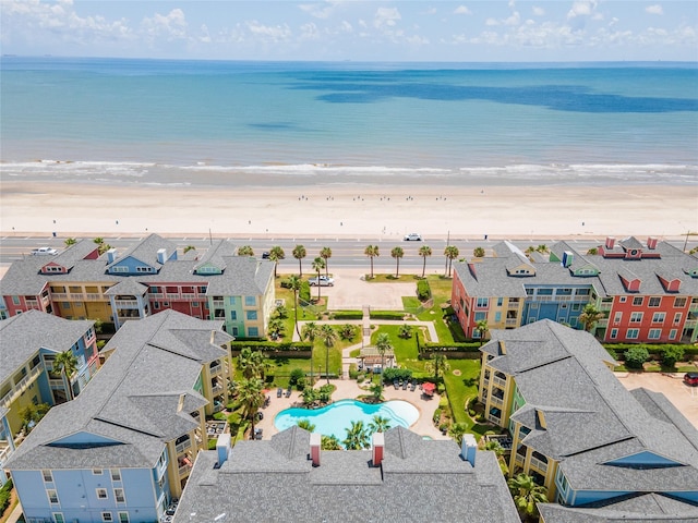 drone / aerial view featuring a water view and a view of the beach