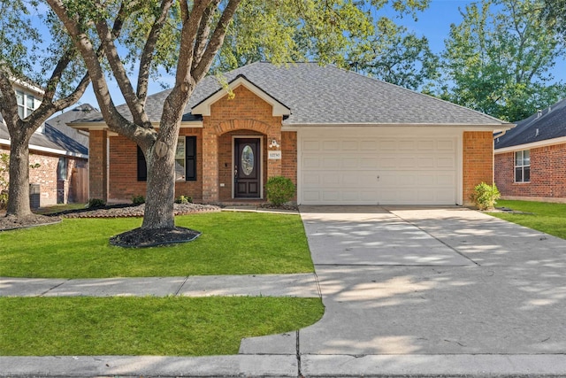 ranch-style house featuring a garage and a front yard