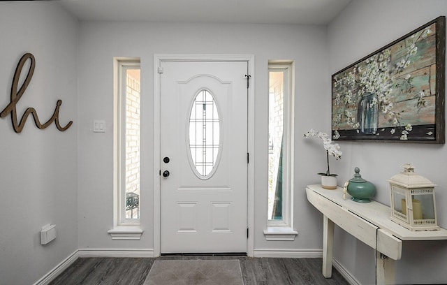 entryway with dark hardwood / wood-style flooring