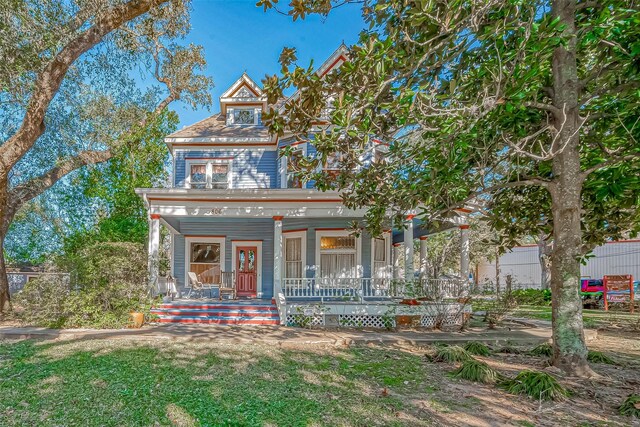 victorian-style house featuring a porch