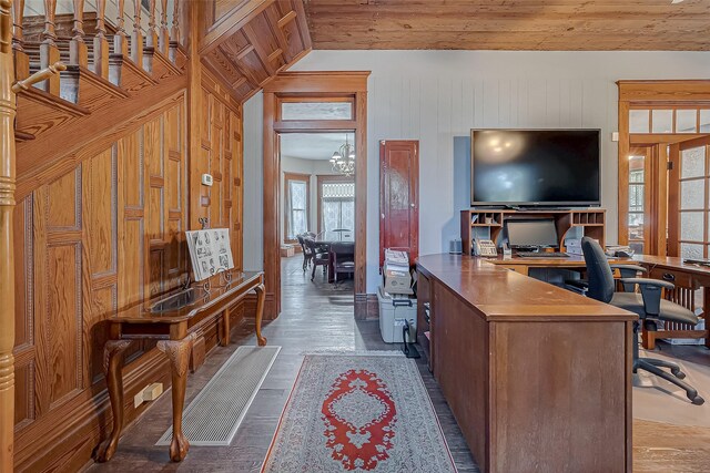 office featuring wood ceiling, wooden walls, wood-type flooring, vaulted ceiling, and a chandelier