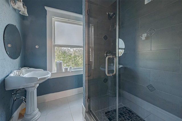 bathroom with tile patterned flooring and walk in shower