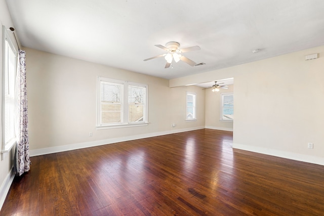 unfurnished room featuring dark hardwood / wood-style floors and ceiling fan