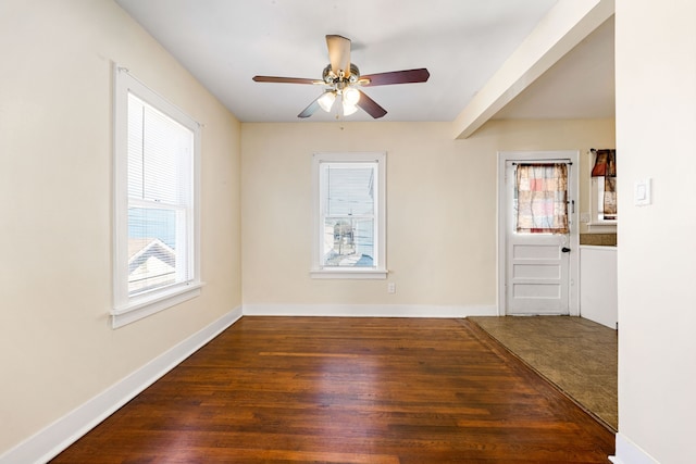 unfurnished room with dark hardwood / wood-style flooring, ceiling fan, and a healthy amount of sunlight