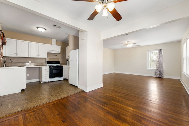 kitchen featuring dark hardwood / wood-style floors, sink, white cabinets, and white appliances