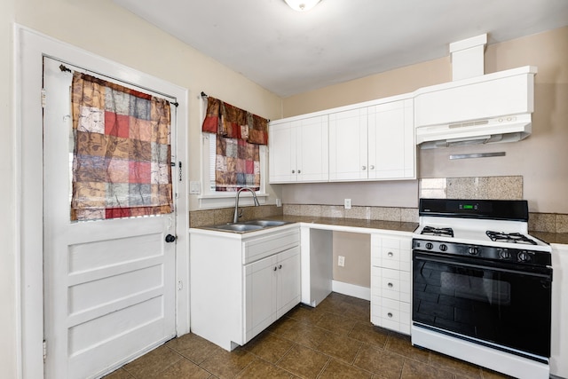 kitchen featuring sink, range with gas cooktop, and white cabinets