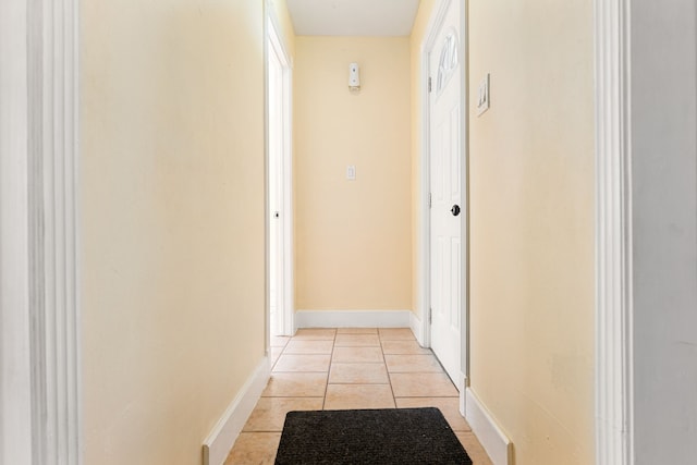 hallway featuring light tile patterned floors