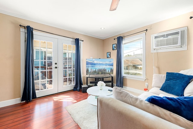 living room with french doors, ornamental molding, a wall mounted AC, and hardwood / wood-style flooring