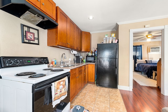 kitchen featuring sink, a wall mounted air conditioner, ornamental molding, range hood, and black appliances