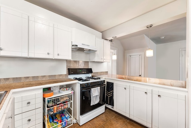 kitchen with range with gas cooktop, white cabinets, dark tile patterned flooring, hanging light fixtures, and kitchen peninsula