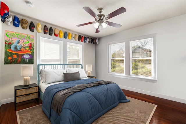 bedroom with dark wood-type flooring and ceiling fan