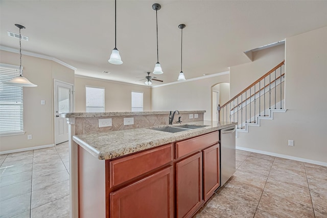 kitchen with pendant lighting, sink, crown molding, dishwasher, and a center island with sink