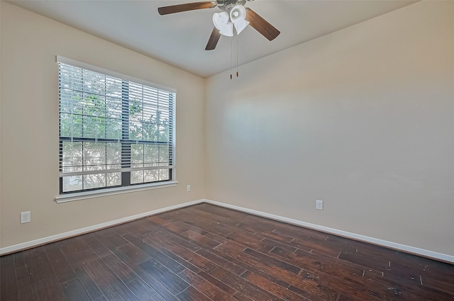 unfurnished room featuring dark wood-type flooring and ceiling fan