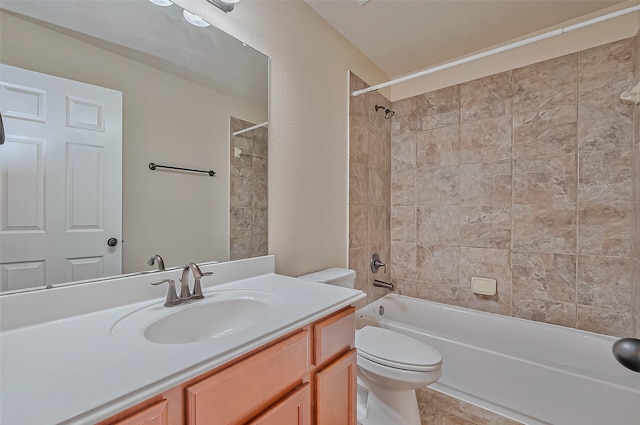 full bathroom with vanity, toilet, and tiled shower / bath