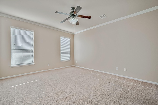 empty room with light carpet, ornamental molding, and ceiling fan