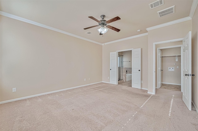 unfurnished bedroom with light colored carpet, ornamental molding, ceiling fan, and ensuite bathroom